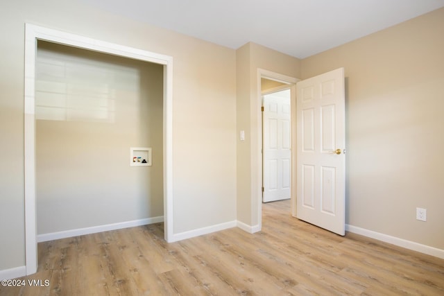 washroom with washer hookup and light wood-type flooring