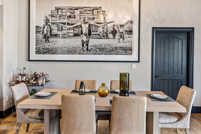 130 Daybreak Rd Unit R401, Beaver Creek, CO 81620 - dining space featuring wood finished floors