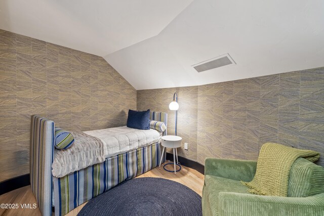 130 Daybreak Rd Unit R401, Beaver Creek, CO 81620 - bedroom featuring vaulted ceiling and wood finished floors