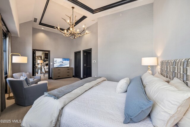 130 Daybreak Rd Unit R401, Beaver Creek, CO 81620 - carpeted bedroom with a chandelier, a towering ceiling, and crown molding