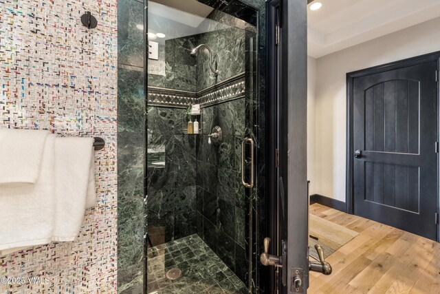 130 Daybreak Rd Unit R401, Beaver Creek, CO 81620 - full bath featuring a stall shower, wood finished floors, and baseboards
