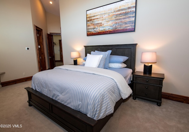 bedroom featuring light carpet