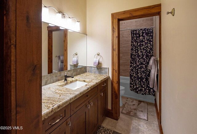 full bathroom featuring vanity, shower / bath combination with curtain, and toilet