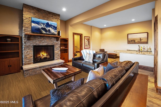 living room featuring a fireplace and light hardwood / wood-style floors