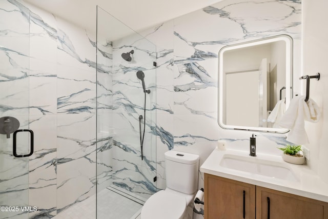 full bathroom with a marble finish shower, toilet, and vanity