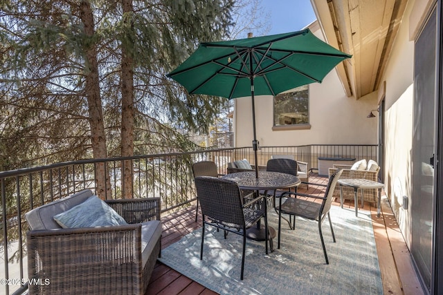 wooden deck with an outdoor living space