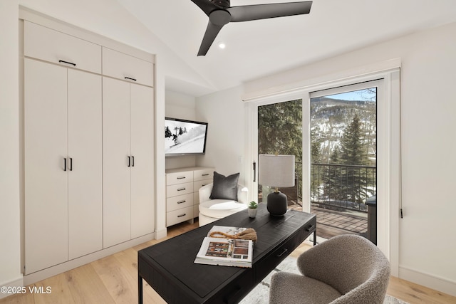 home office with lofted ceiling, baseboards, light wood finished floors, and ceiling fan