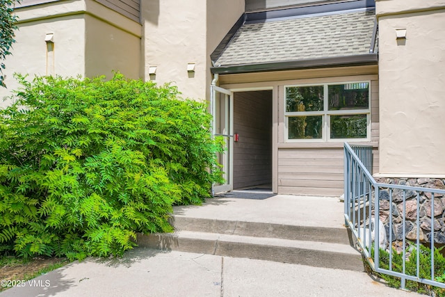 55 River Pines Ct Unit A204, Edwards, CO 81632 - property entrance featuring roof with shingles and stucco siding