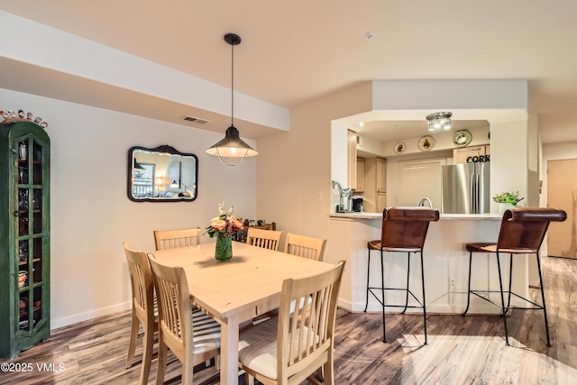 55 River Pines Ct Unit A204, Edwards, CO 81632 - dining space featuring light wood-type flooring and baseboards
