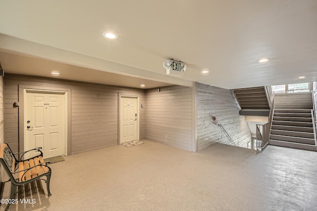 55 River Pines Ct Unit A204, Edwards, CO 81632 - basement with carpet floors, wooden walls, recessed lighting, and stairs