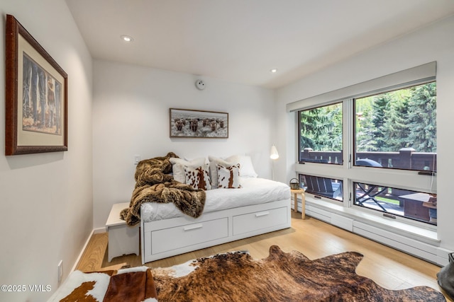 103 Willow Pl Unit 301, Vail, CO 81657 - bedroom with wood finished floors and recessed lighting