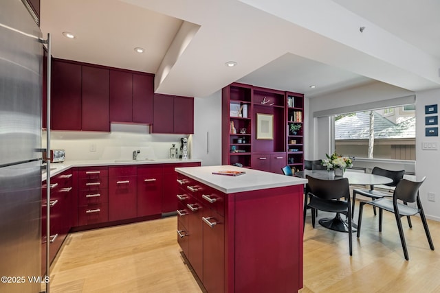 103 Willow Pl Unit 301, Vail, CO 81657 - kitchen with stainless steel refrigerator, red cabinets, light wood-type flooring, modern cabinets, and recessed lighting