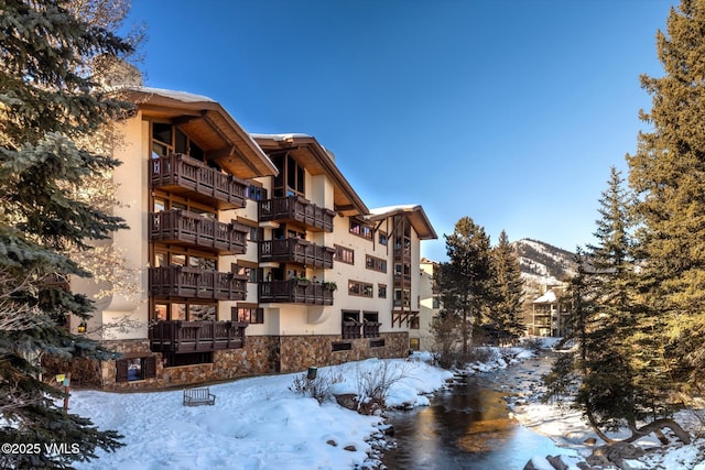 snow covered building with a mountain view