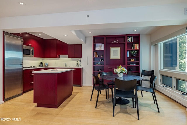 103 Willow Pl Unit 301, Vail, CO 81657 - kitchen featuring stainless steel appliances, modern cabinets, a kitchen island, light wood-type flooring, and recessed lighting