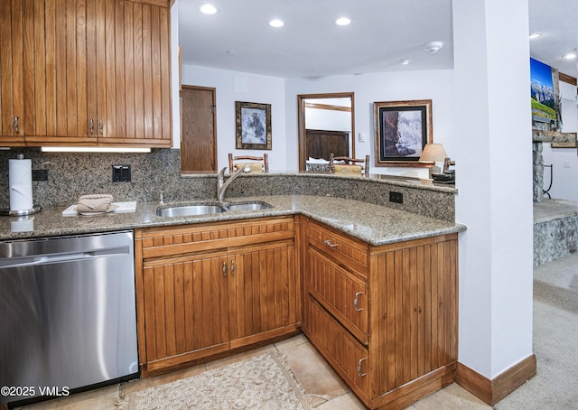 120 Offerson Rd Unit 6140, Beaver Creek, CO 81620 - kitchen featuring stainless steel dishwasher, light stone counters, brown cabinets, a peninsula, and recessed lighting