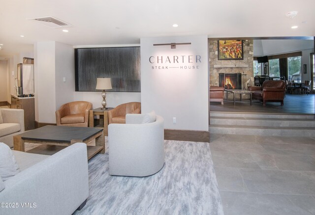 120 Offerson Rd Unit 6140, Beaver Creek, CO 81620 - living area featuring a stone fireplace, recessed lighting, and tile patterned flooring