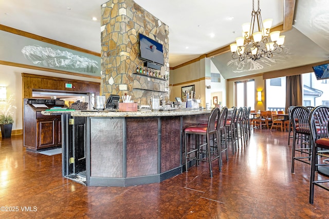 120 Offerson Rd Unit 6140, Beaver Creek, CO 81620 - indoor wet bar featuring crown molding, a chandelier, and pendant lighting