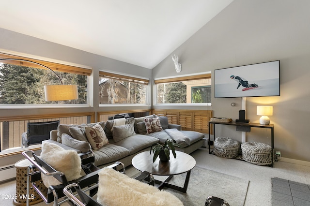 living area featuring baseboards, carpet, and high vaulted ceiling