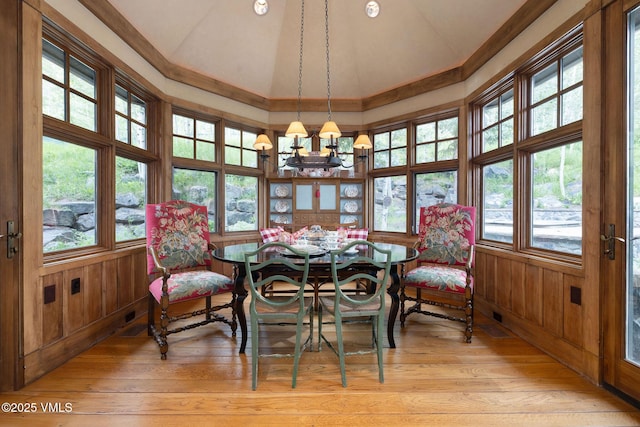 780 Potato Patch Dr, Vail, CO 81657 - dining room with a chandelier, plenty of natural light, light wood-style flooring, high vaulted ceiling, and wooden walls