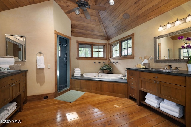780 Potato Patch Dr, Vail, CO 81657 - bathroom with wooden ceiling, vaulted ceiling, hardwood / wood-style floors, ceiling fan, and a garden tub