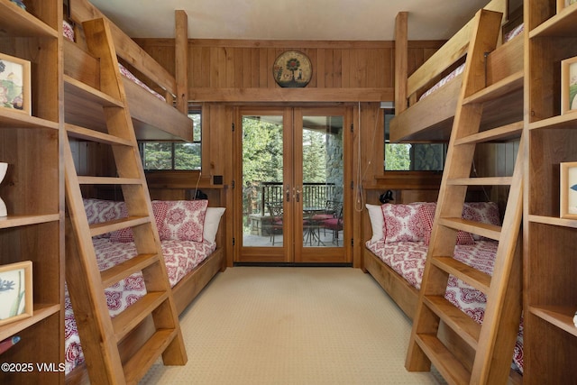 780 Potato Patch Dr, Vail, CO 81657 - bedroom featuring french doors, access to outside, carpet flooring, and wood walls