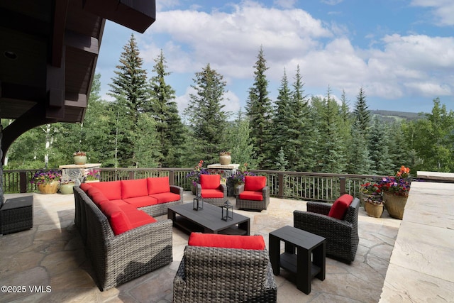 780 Potato Patch Dr, Vail, CO 81657 - view of patio with an outdoor living space and a wooded view