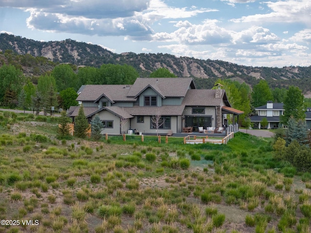 4 E Dewey Park, Eagle, CO 81631 - rear view of house with a mountain view and a chimney