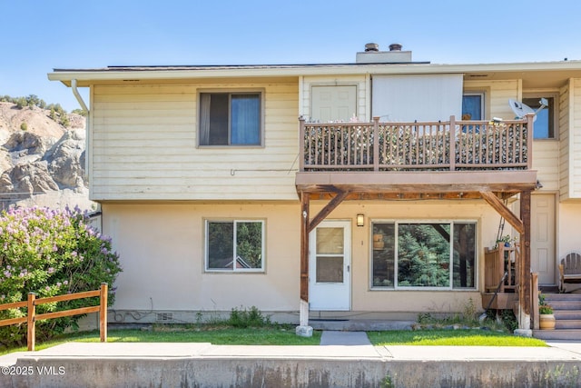 600 Price Ln Unit 1, Gypsum, CO 81637 - view of front of house featuring a chimney, crawl space, and a deck
