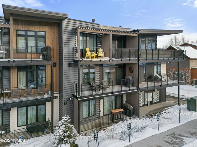 view of snow covered property