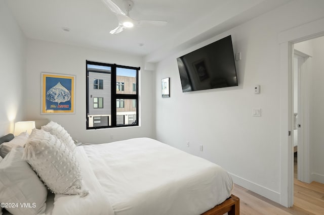 bedroom featuring ceiling fan and light hardwood / wood-style floors