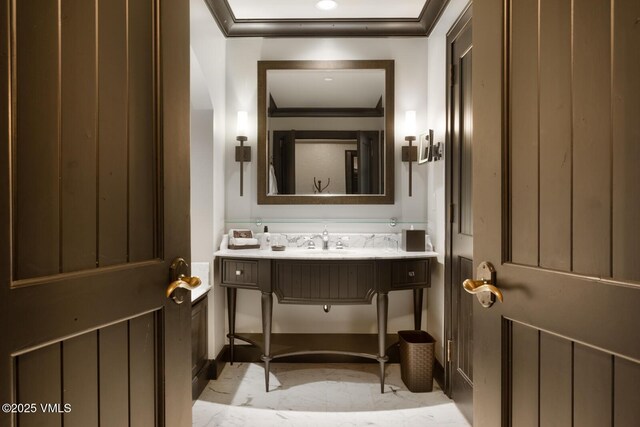 bathroom featuring sink and crown molding