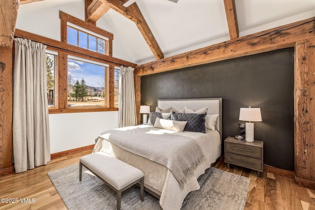 674 Hernage Creek Rd, Eagle, CO 81631 - bedroom featuring wood finished floors, beam ceiling, and high vaulted ceiling