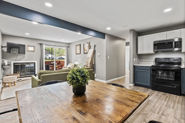 1061 W Beaver Creek Blvd Unit F101, Avon, CO 81620 - dining room with recessed lighting, light wood-style flooring, baseboards, and a glass covered fireplace
