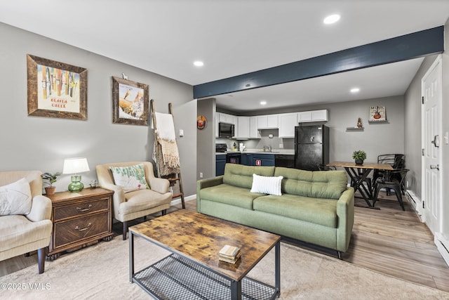 1061 W Beaver Creek Blvd Unit F101, Avon, CO 81620 - living area featuring light wood finished floors, recessed lighting, and baseboards