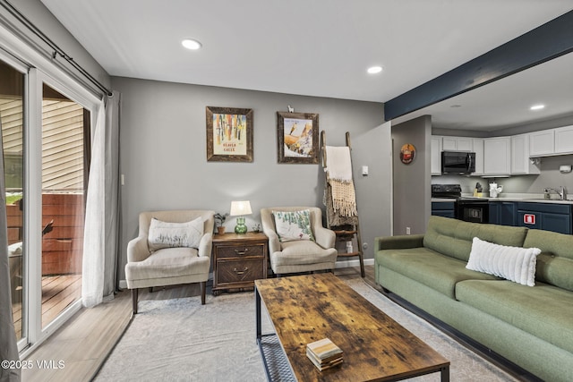1061 W Beaver Creek Blvd Unit F101, Avon, CO 81620 - living room featuring recessed lighting, light wood-style flooring, and baseboards