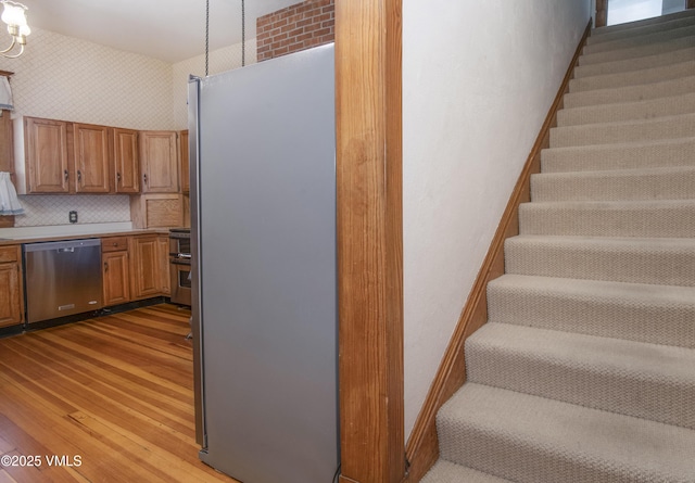 409 Washington St, Eagle, CO 81631 - stairs featuring wood finished floors