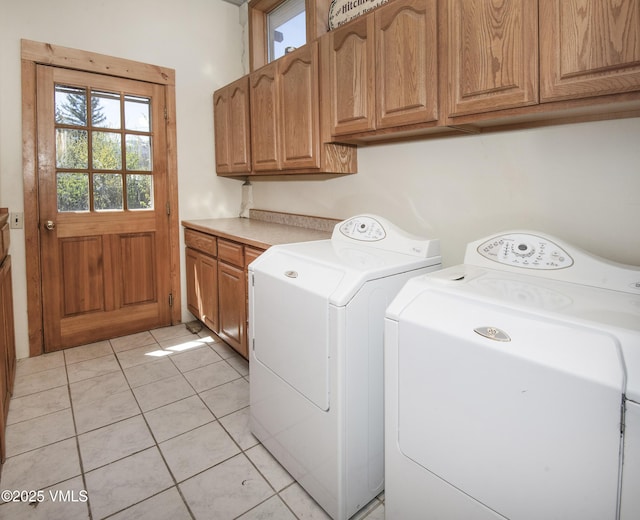 409 Washington St, Eagle, CO 81631 - laundry room featuring cabinet space, independent washer and dryer, plenty of natural light, and light tile patterned floors
