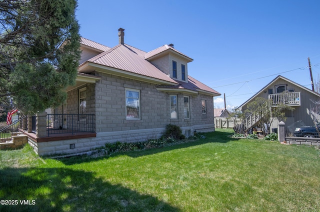 409 Washington St, Eagle, CO 81631 - rear view of house with a lawn, stairway, metal roof, and a porch