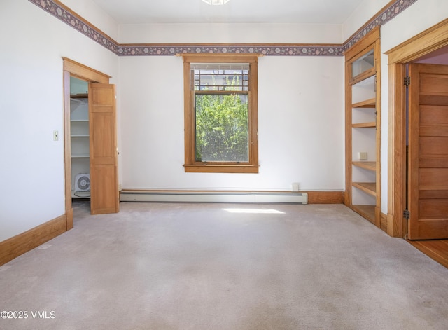 409 Washington St, Eagle, CO 81631 - carpeted spare room featuring a baseboard heating unit and baseboards