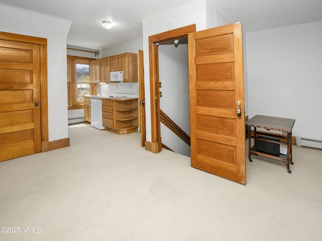 409 Washington St, Eagle, CO 81631 - kitchen featuring white appliances, light colored carpet, open shelves, and light countertops
