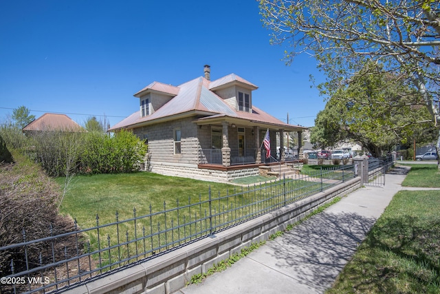 409 Washington St, Eagle, CO 81631 - view of side of home featuring a porch, metal roof, and a chimney