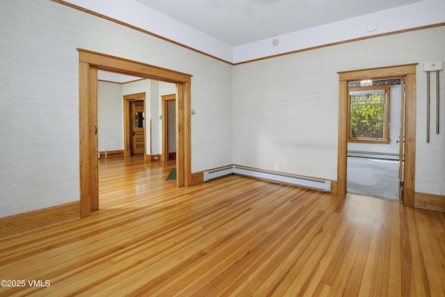 409 Washington St, Eagle, CO 81631 - empty room with hardwood / wood-style floors, a baseboard radiator, baseboard heating, and baseboards