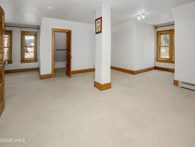 409 Washington St, Eagle, CO 81631 - below grade area featuring baseboards, a baseboard heating unit, and light carpet