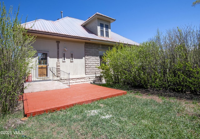409 Washington St, Eagle, CO 81631 - back of property featuring a yard, metal roof, and a deck