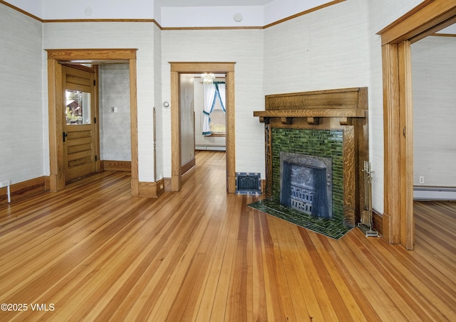 409 Washington St, Eagle, CO 81631 - unfurnished living room with baseboards, hardwood / wood-style floors, baseboard heating, and a baseboard radiator