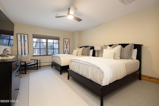 bedroom with light carpet and ceiling fan