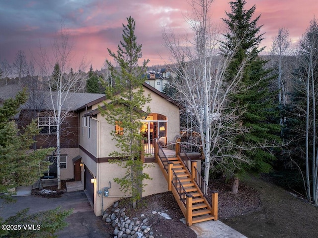 50 Andover Trl, Edwards, CO 81632 - exterior space with stucco siding, stairs, and a garage