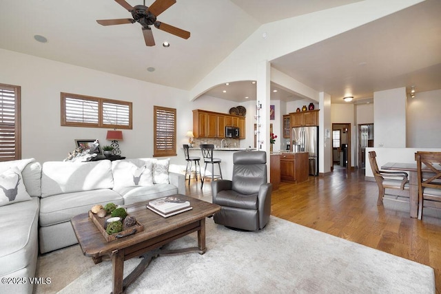 50 Andover Trl, Edwards, CO 81632 - living area with lofted ceiling, a ceiling fan, and wood finished floors