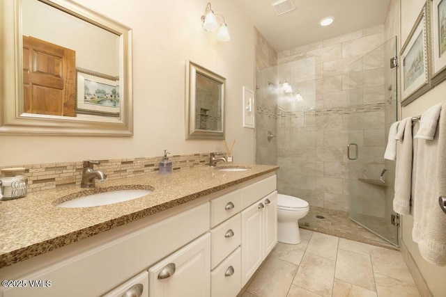 50 Andover Trl, Edwards, CO 81632 - full bathroom featuring visible vents, a sink, a shower stall, and double vanity