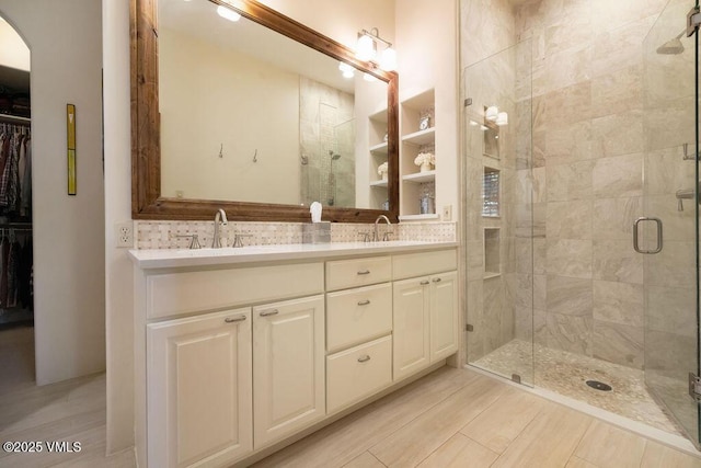 50 Andover Trl, Edwards, CO 81632 - full bath featuring double vanity, a spacious closet, a stall shower, and a sink